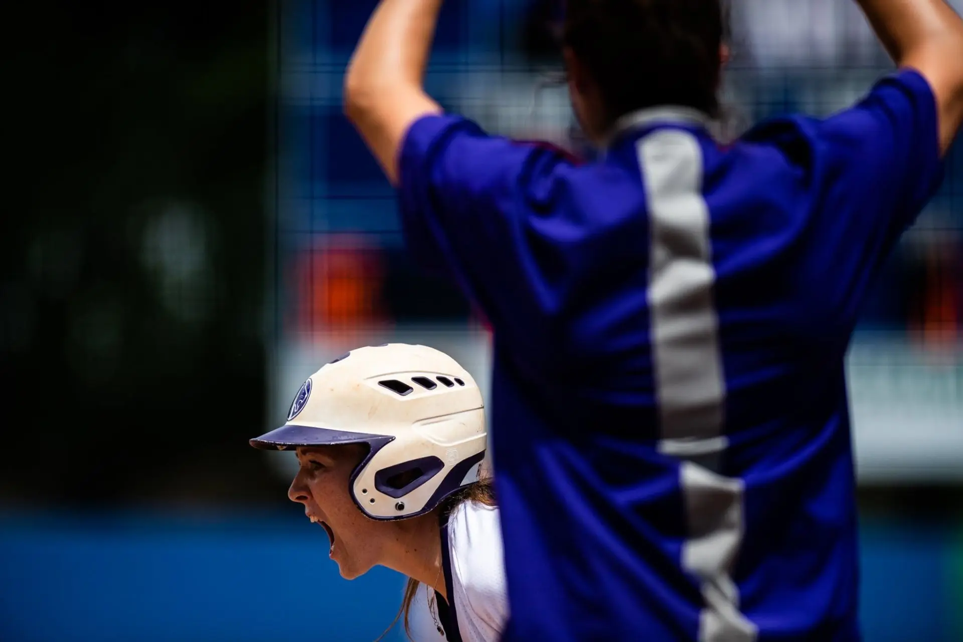 Danielle de Ruiter shouting in celebration behind a North Alabama teammate