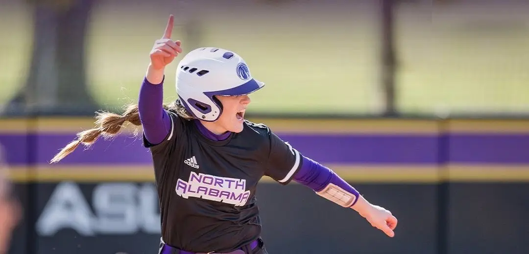 Danielle de Ruiter pointing skyward and shouting in celebration for North Alabama