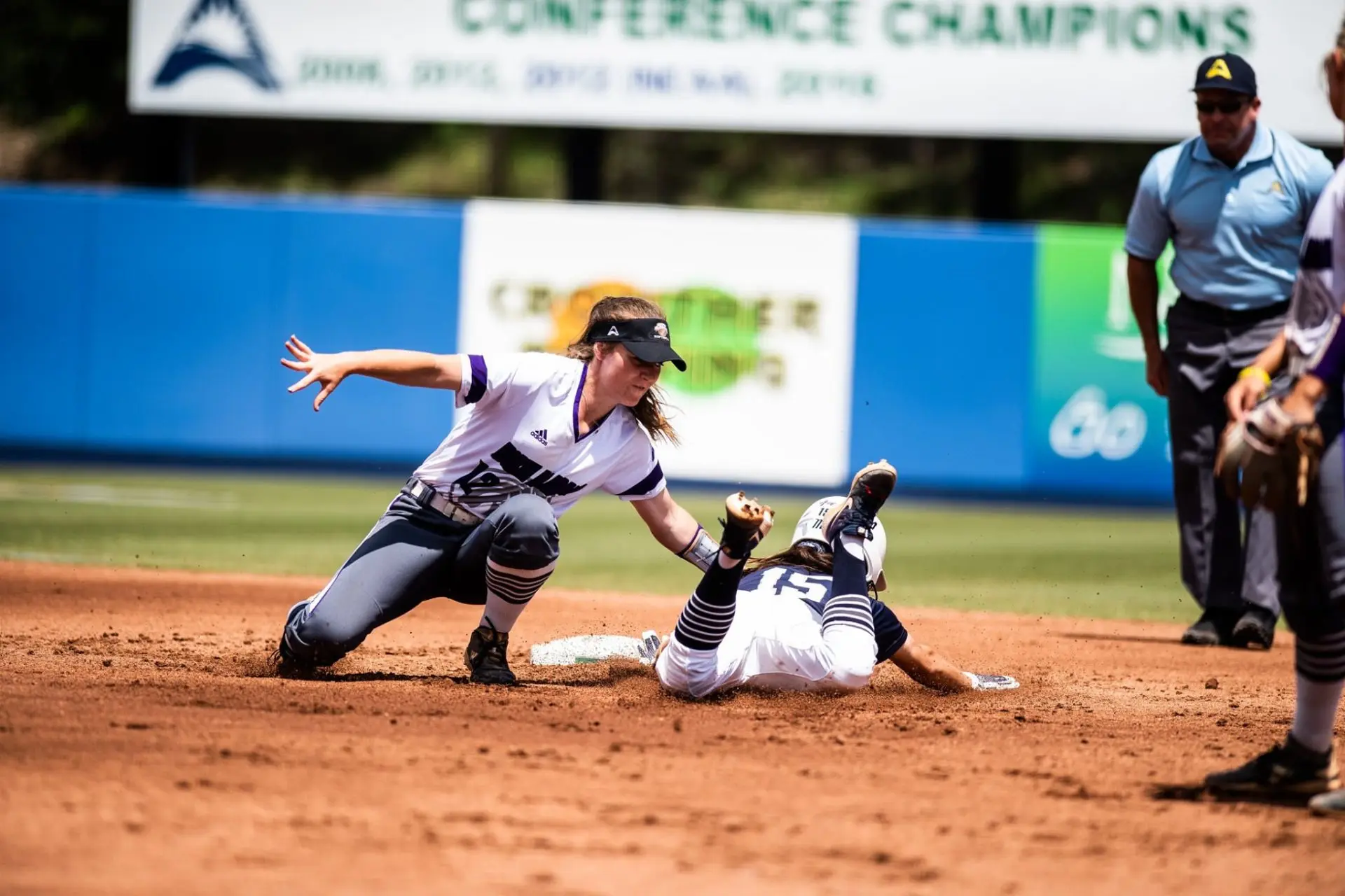 Danielle de Ruiter applying a tag on a sliding runner for North Alabama