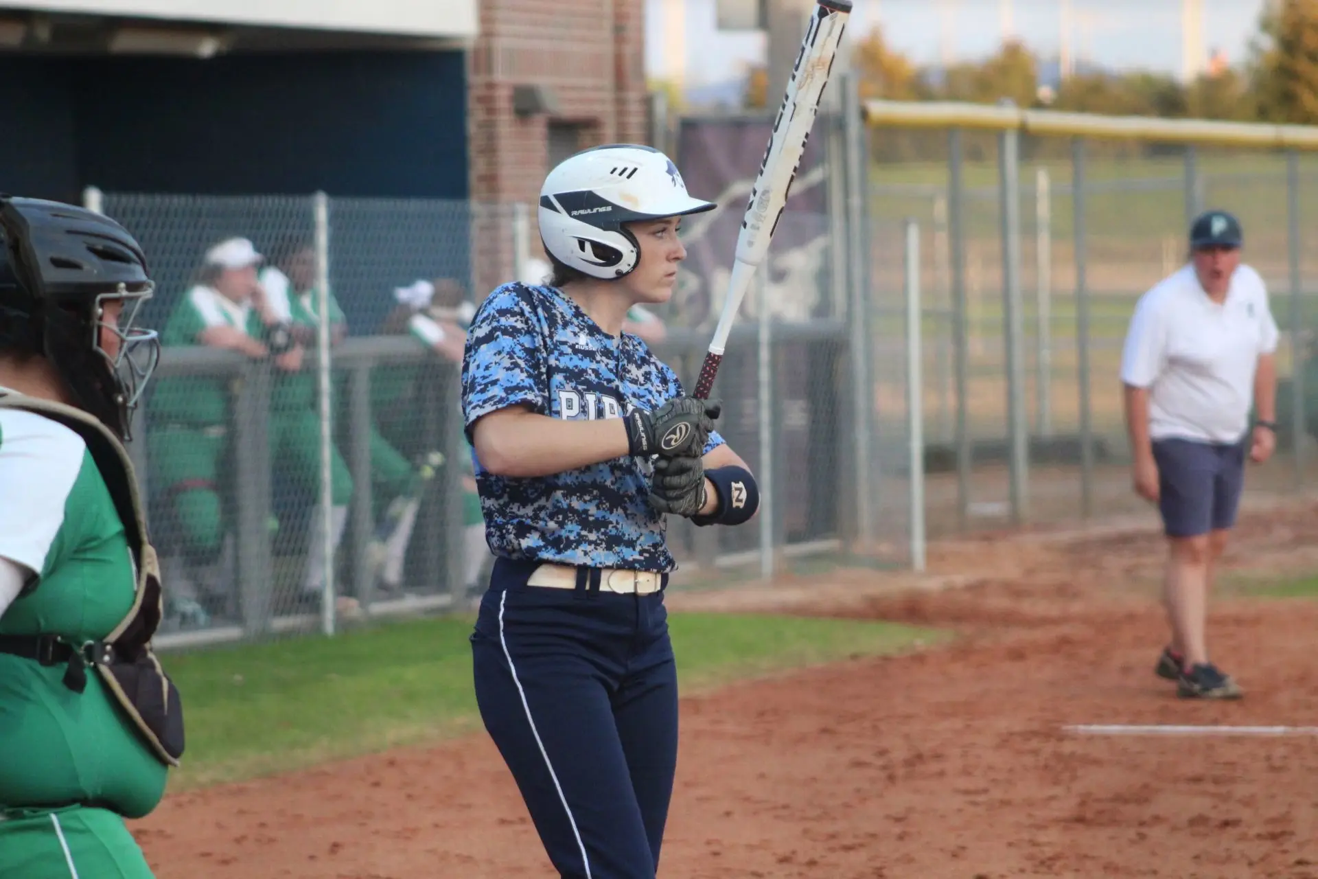 Danielle de Ruiter holding a bat between pitches for Pensacola State
