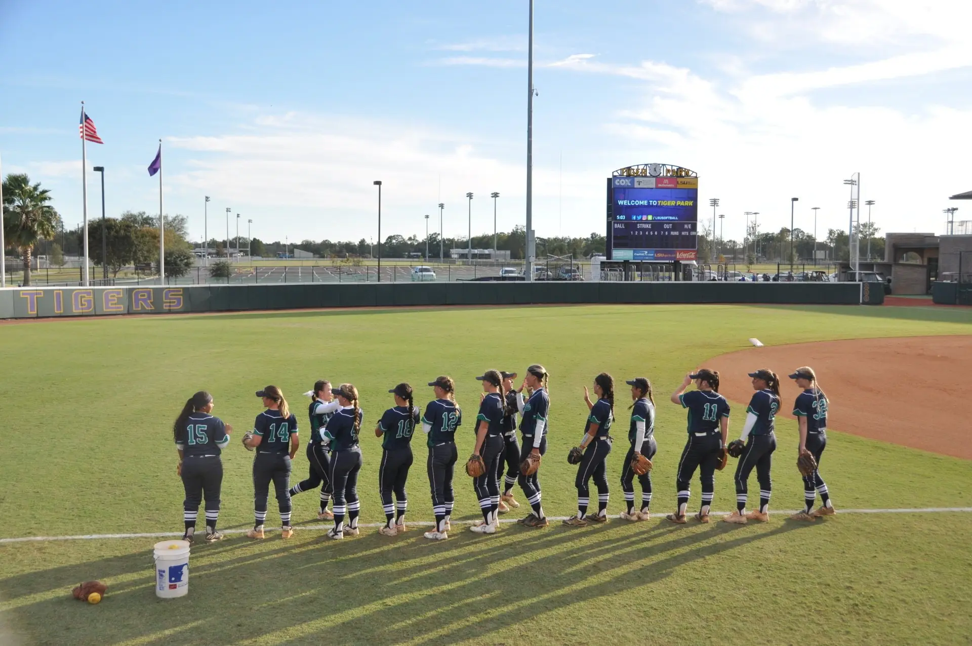 Pensacola State players lined up on the field before playing LSU