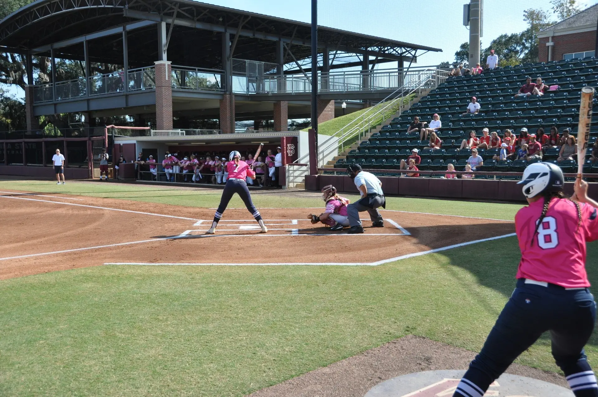 Danielle de Ruiter at the plate against LSU, with a teammate on deck